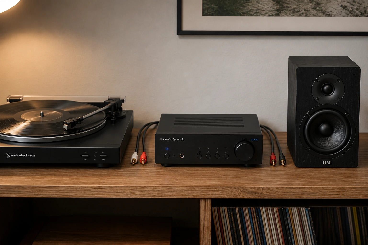 Home audio signal chain showing turntable connected to amplifier and bookshelf speakers