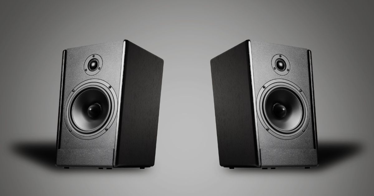 Two sound speakers on a gray background