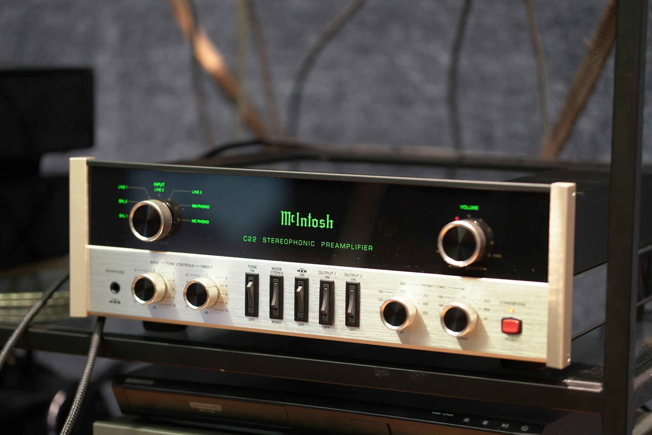 Close-up of amplifier volume knobs and audio controls