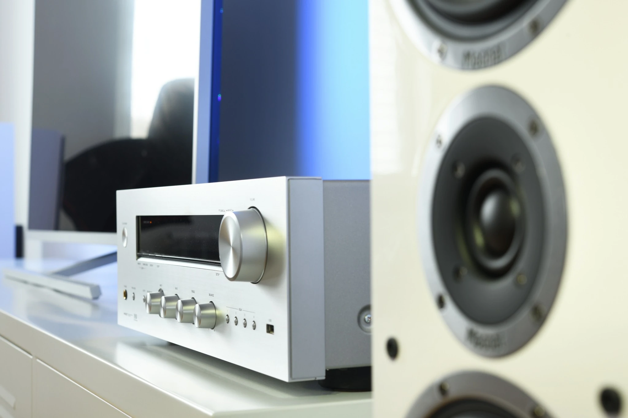 Integrated amplifier and bookshelf speaker in a realistic home listening room setup