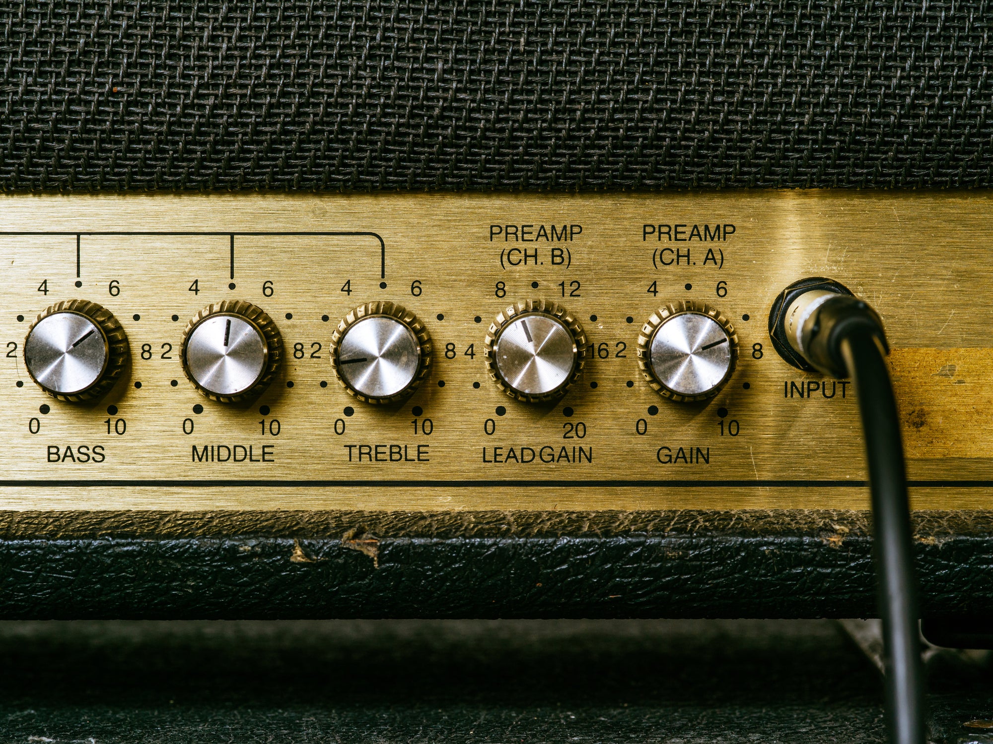 Amplifier volume knob set at moderate listening level in home setup