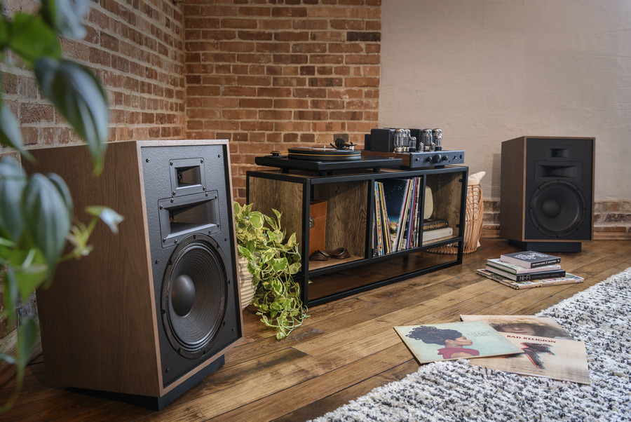 Balanced home audio system with integrated amplifier, speakers, and turntable in a living room
