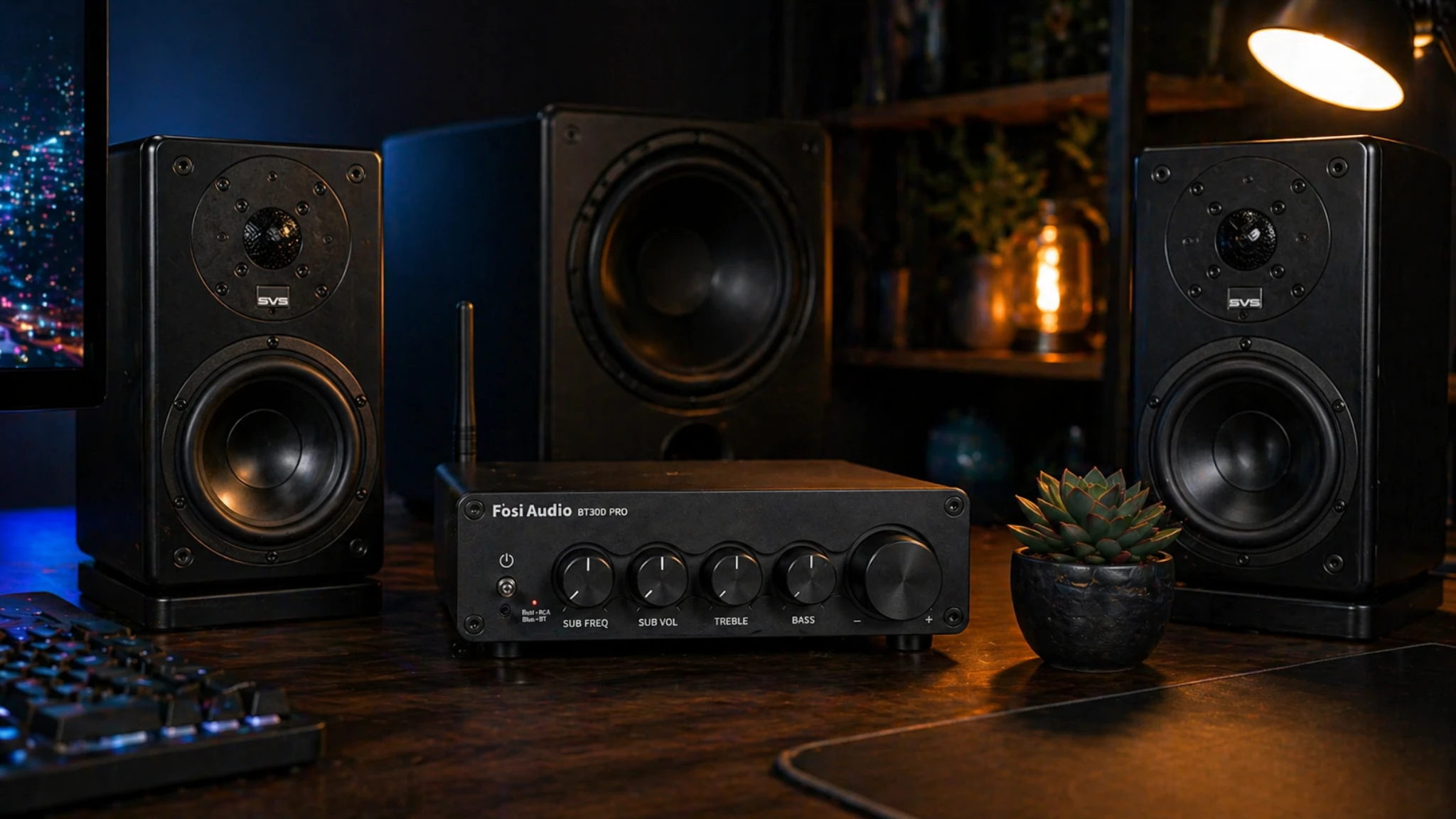Fosi Audio BT30D Pro 2.1 channel amplifier in a night desk audio setup