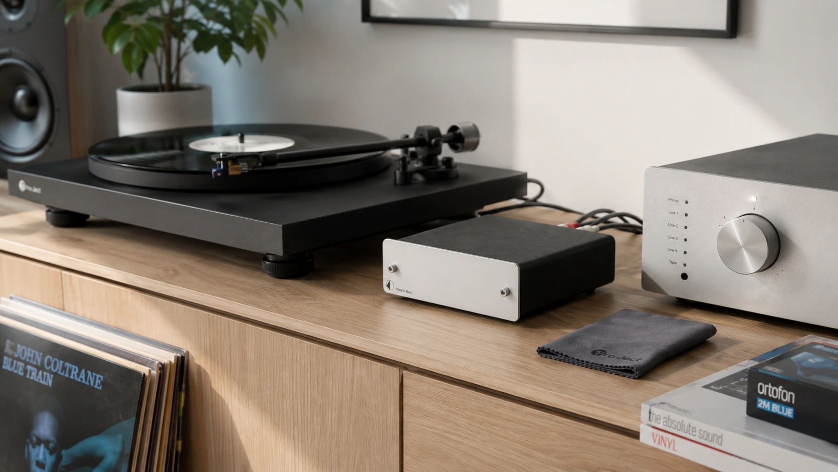 Pro-Ject Phono Box DC MM/MC phono preamp connected to a Pro-Ject turntable on a bright modern hi-fi setup